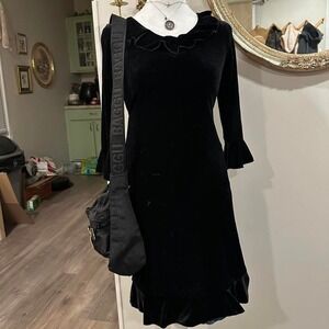 Black velvet midi dress with ruffle details #gothicglam